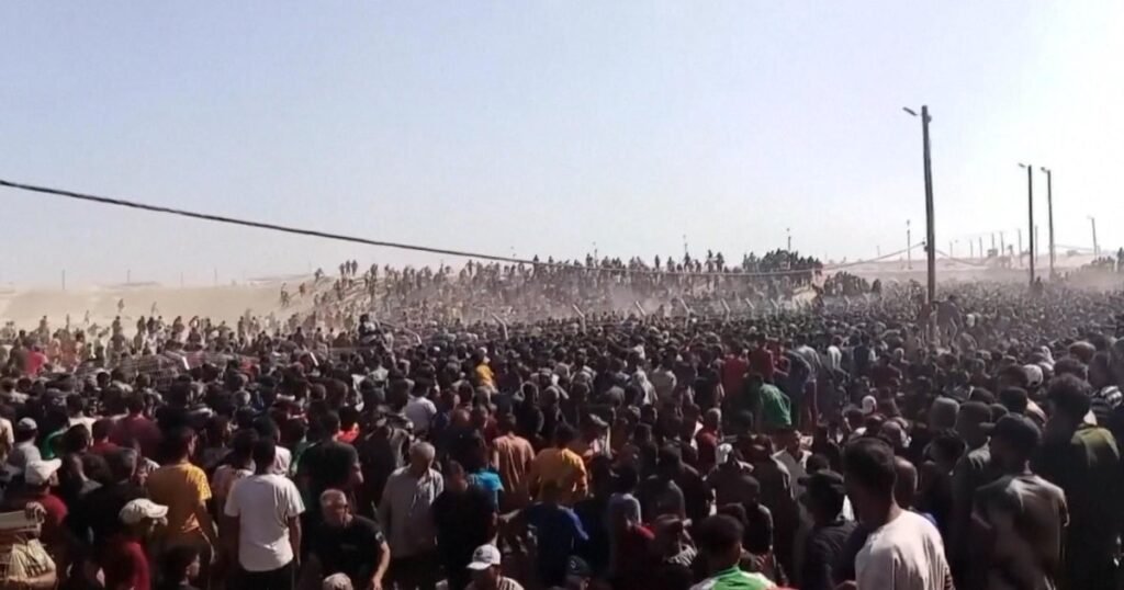 Palestinians-rush-to-new-aid-centers-in-Gaza-as-chaos.jpg