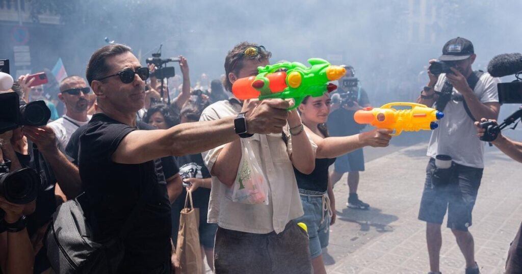 Some-Spanish-residents-armed-with-water-guns-want-tourists-to.jpg
